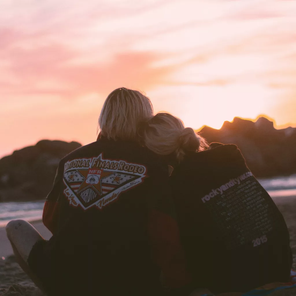 pexels-photo-2221357-2221357 A couple embraces on the beach during a romantic sunset, symbolizing love and togetherness.